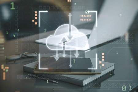 Close up of workplace desktop with tablet, other items and digital cloud computing hologram on...