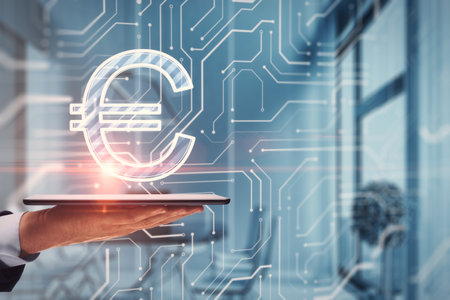 Close up of hand holding cellphone with glowing euro circuit sign on blurry office interior background. Digital money transaction concept. double exposureの写真素材