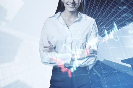 Young woman with folded arms and growing forex chart on blurry city background. Trade, finance and stock concept. double exposureの写真素材