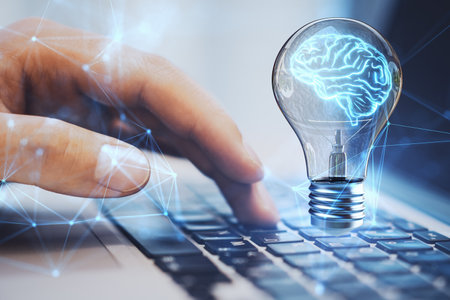 Close up of male hand using laptop with lamp, brain hologram and polygonal mesh on blurry...
