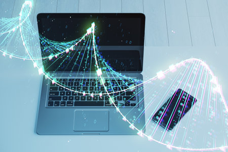 Close up of workplace with glowing DNA hologram, laptop and other items on blurry background....