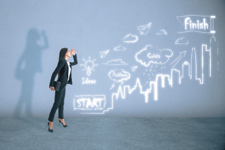 Attractive young european businesswoman looking into the distance and standing on concrete wall background with creative business sketch. Success, marketing, future and idea conceptの写真素材