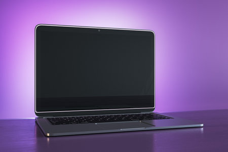 Creative purple designer workplace with empty black mock up laptop screen. 3D Renderingの写真素材
