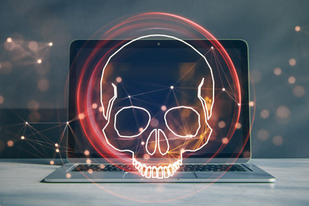 Hacking attack and online piracy creative concept with red skull digital hologram on modern laptop...