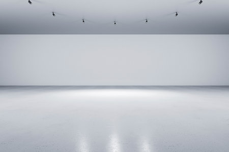 Abstract empty exhibition hall with spotlight and gray concrete floor and blank wall. Gallery or modern museum background, mockup. 3D Renderingの写真素材