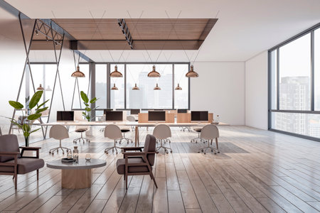 Front view on spacious sunlit coworking office interior design with modern computers on light work...