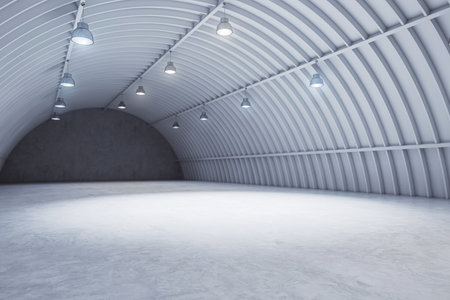 Perspective view gray hangar interior with spotlight and concrete floor, car background and empty stage concept. 3D rendering, mockupの写真素材