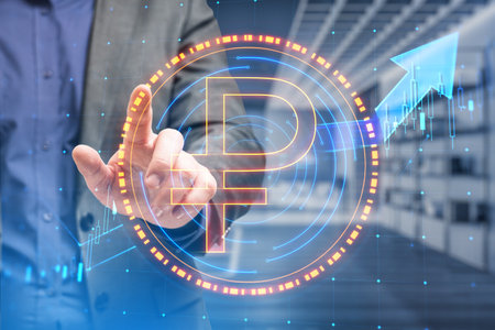 Close up of businessman hand pointing at digital round ruble sign on blurry office interior background. Online banking, cryptocurrency and finance concept. double exposureの写真素材