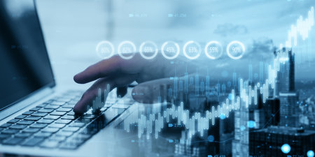 Close up of hand using laptop with creative candlestick forex chart or graph on blurry wide city...