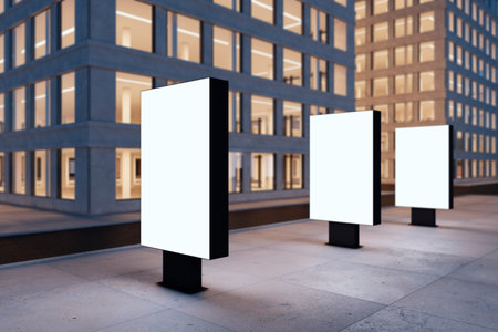 Nighttime city with skyscrapers and empty white mock up banners for ads. Commercial, advertising and modern living concept. 3D Renderingの写真素材