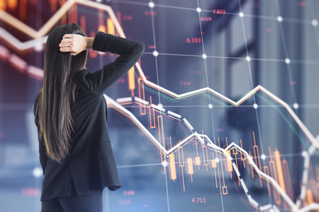 Stressed young woman looking at falling forex chart with index on blurry office interior background. Crisis and declining trade concept. double exposureの写真素材