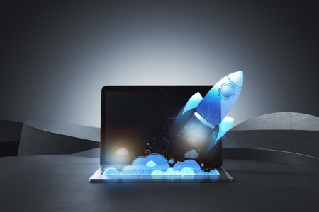 Close up of laptop and glowing flying blue rocket. Start up and launch concept. 3D Renderingの写真素材