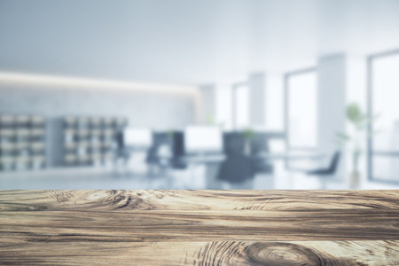 Close up of empty wooden desktop with product placement mock up place on blurry office interior backdrop. 3D Renderingの写真素材