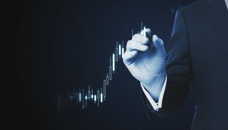 Businessman hand drawing stock market graph on virtual screen. Finance and trade concept.の写真素材