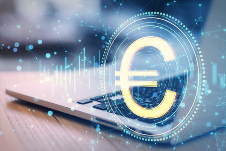 Close up of laptop with creative round euro coin and polygonal mesh hologram on blurry background. Digital money and finance concept. double exposureの写真素材