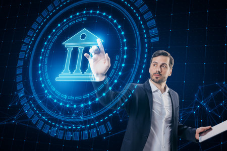 Attractive young European businessman using creative round polygonal banking hologram on blurry background. Digital transformation and finance conceptの写真素材