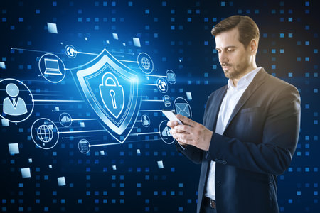 Attractive young European businessman using smartphone with creative glowing padlock hologram on...