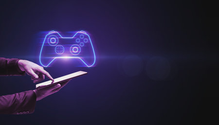 Closeup of businessman hand pointing at cellphone with creative joystick or gamepad hologram on blurry purple bokeh background. Esport, gaming and fun conceptの写真素材