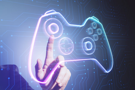 Close up of male hand pointing at creative joystick or gamepad hologram on blurry background....