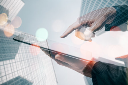 Close up of business man hand using smartphone on blurry bokeh city background. Network,...