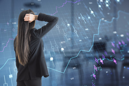 Back view of thoughtful European businesswoman with glowing forex chart and grid hologram on blurry office interior background. Stock, financial growth and trade concept. Double exposureの写真素材