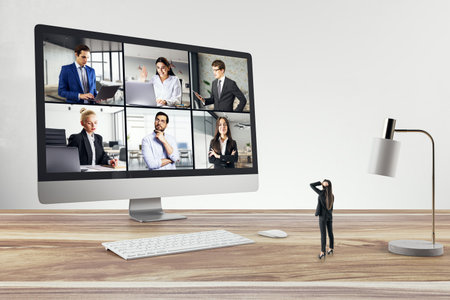 Digital conference call with diverse business professionals on a laptop screen, remote work conceptの写真素材