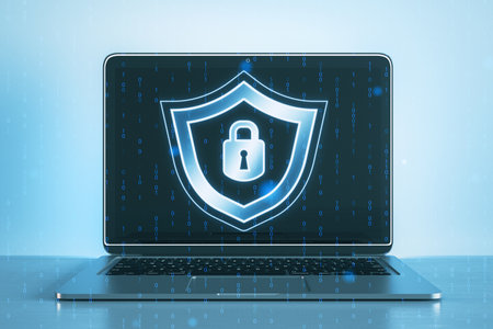 Close up of laptop with creative digital security padlock and shield hologram on blurry binary code...
