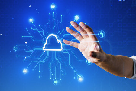 Close up of businessman hand using creative digital circuit cloud on blue background. Data storage,...