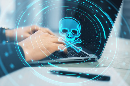 Side view of male hands using laptop with creative skull hologram on blurry background. Cyber attack and piracy concept. Double exposureの写真素材