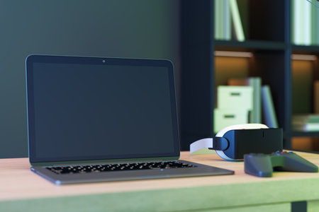 Creative gray designer gamer's gaming space with mock up place on laptop screen vr glasses and other...