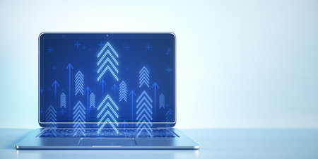 Close up of laptop at workplace with growing blue business chart arrows on blurry wide background with mock up place. Success, trend and financial growth concept. 3D Renderingの写真素材