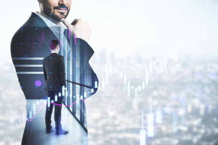 Back view of young businessman standing on bright city background with mock up place and forex chart. Success and occupation concept. Double exposureの写真素材