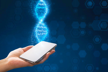 Close up of female hand holding smartphone with glowing DNA helix on blurry blue background. Medical and heredity genetic health concept. Technology scienceの写真素材