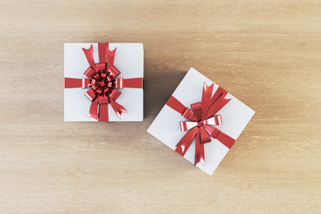 Top view of two white present boxes on wooden surface. Gift concept. 3D Rendering