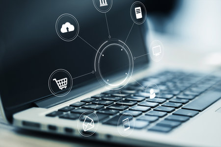 Close up of notebook on desk with creative round digital interface with various icons. Digital...