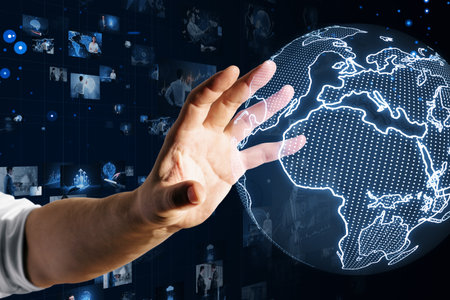 Man presenting interactive digital globe, futuristic network concept. Dark backgroundの写真素材