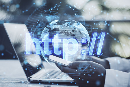 A digital globe with the inscription 'http://' on a laptop screen, symbolizing global internet...