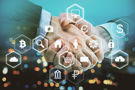 creative handshake and business hologram on blurry bokeh night city backdrop. Financial growth and...