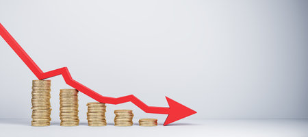 Stacks of coins with a red arrow pointing down indicating a financial crisis, set on a plain white...
