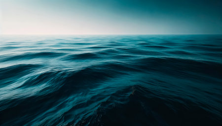 A dark and serene ocean landscape showing gentle waves, with a creative concept on a gradient blue background. Generative AIの素材