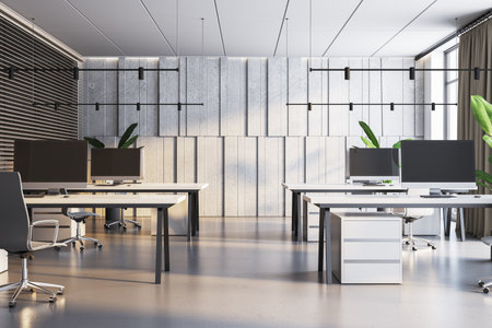 Modern office interior with concrete panels, black accents, and vibrant green plants. 3D Renderingの写真素材