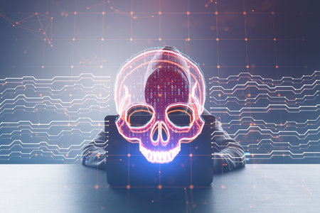 Front view of hacker at desk using laptop with creative skull and circuit hologram on blurry background. Malware and ransomware conceptの写真素材