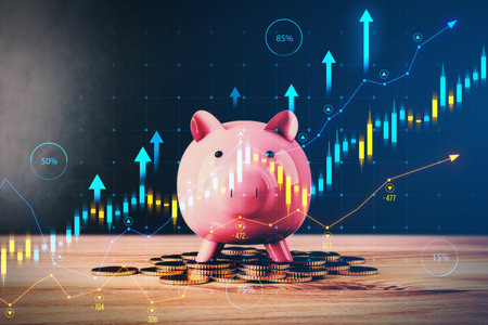 Close up of pink piggy bank on wooden surface with growing forex chart on blurry background. Trade, growing income and stock concept. Double exposureの写真素材