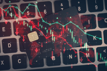 Close up of bank cards and laptop keyboard with falling red forex chart and map. Trade, investment...