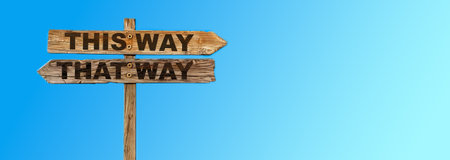 Wooden signpost with "THIS WAY, THAT WAY" against a blue sky, symbolizing decisions and direction. Generative AIの素材