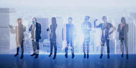 Businesspeople silhouettes on blurry toned blue city backdrop. Success, teamwork and workspace concept. Double exposureの写真素材
