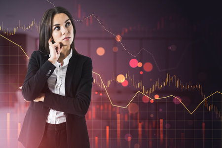 Attractive thoughtful young European businesswoman with downward red forex chart on blurry background. Crisis and financial recession concept. Double exposureの写真素材