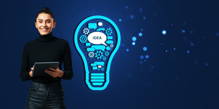 A woman holding a tablet, standing next to a lightbulb graphic filled with gears, speech bubbles, and idea icons on a dark blue background, representing concepts of creativity and innovationの写真素材