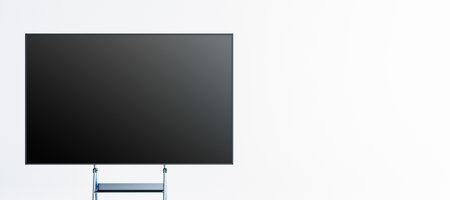 An empty blackboard on a stand in a modern, minimalistic room. The blackboard is positioned against...