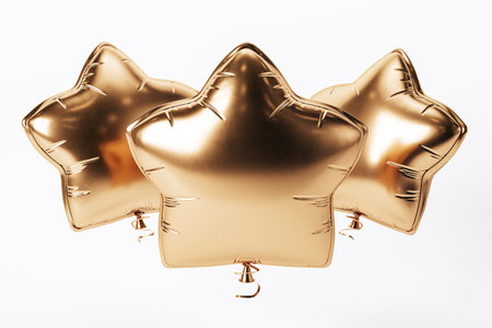 Three gold star-shaped balloons floating against a plain white background. Concept of celebration and party decoration. 3D renderingの写真素材